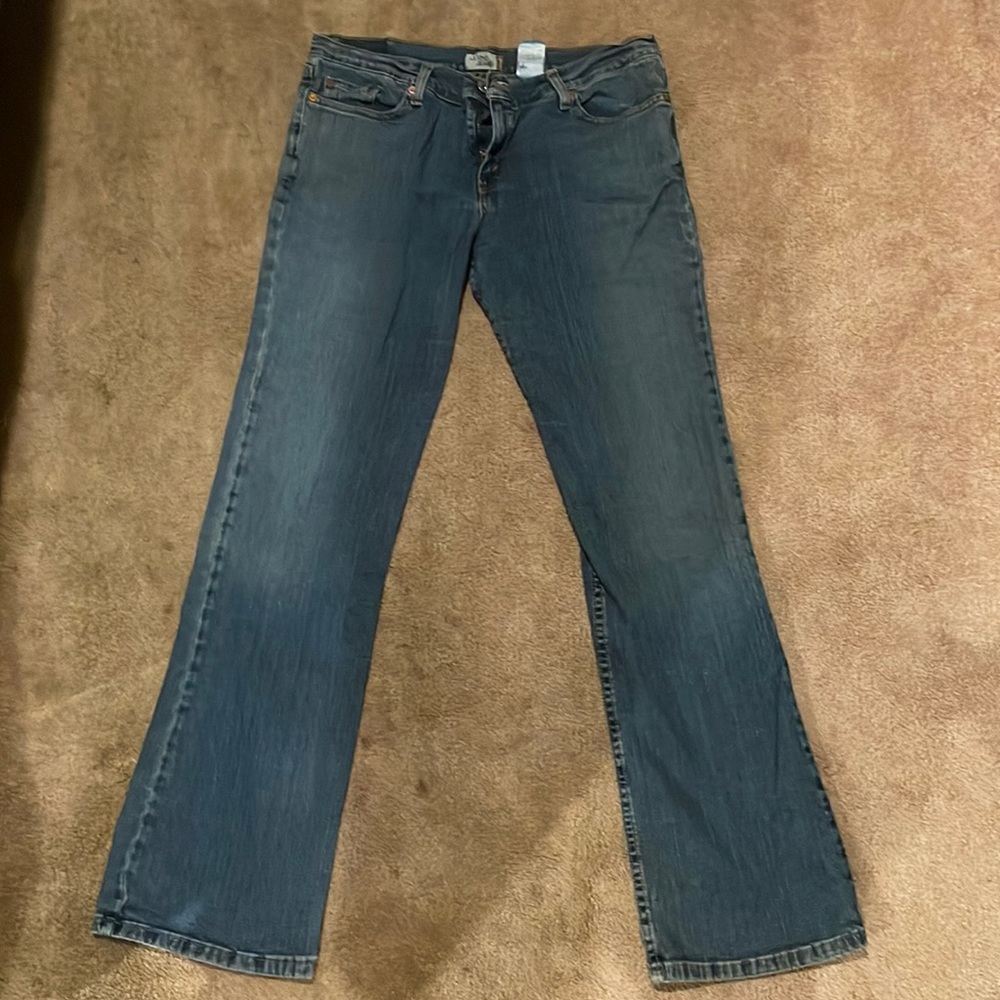 Levi’s 13 Long, stretchy for comfort.